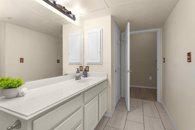 2815 Kings Crossing Dr Unit 102, Houston, TX 77345 - bathroom featuring vanity and baseboards