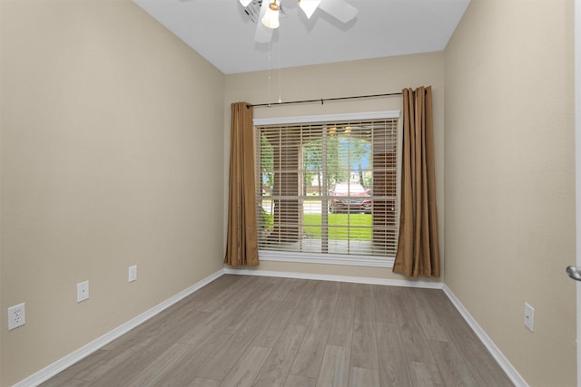2815 Kings Crossing Dr Unit 102, Houston, TX 77345 - unfurnished room featuring light wood finished floors, baseboards, and ceiling fan