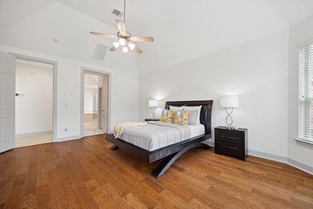 3505 Parkside Dr, Pearland, TX 77584 - bedroom featuring wood finished floors, multiple windows, high vaulted ceiling, baseboards, and ceiling fan