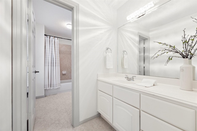 3505 Parkside Dr, Pearland, TX 77584 - bathroom featuring vanity, shower / tub combo with curtain, tile patterned floors, and baseboards