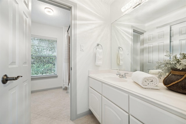 3505 Parkside Dr, Pearland, TX 77584 - full bath featuring vanity, baseboards, tile patterned flooring, and a shower with curtain