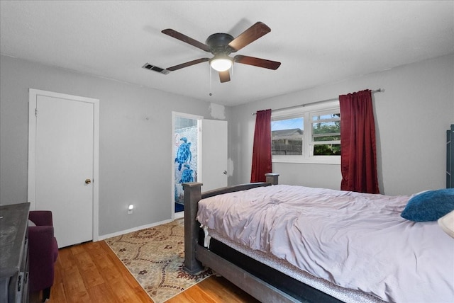 4205 Baron Ln, Deer Park, TX 77536 - bedroom with wood finished floors, a ceiling fan, and baseboards