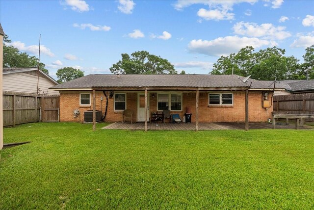 4205 Baron Ln, Deer Park, TX 77536 - rear view of property featuring brick siding, central AC unit, and a deck