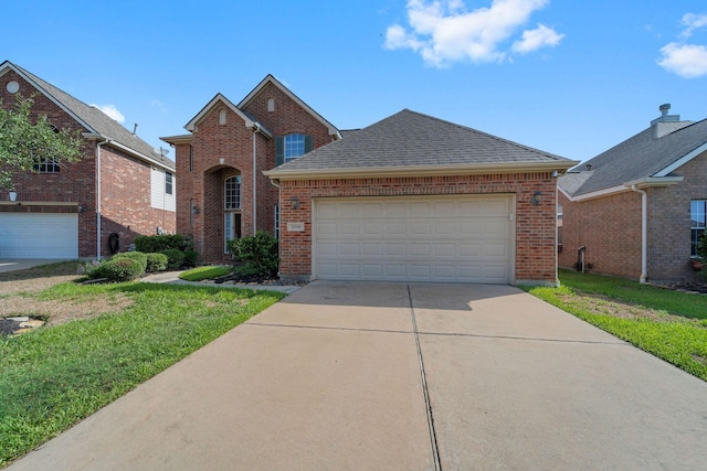 22610 Torrisdale Ln, Tomball, TX 77375 - traditional home featuring brick siding, concrete driveway, a front yard, and a shingled roof