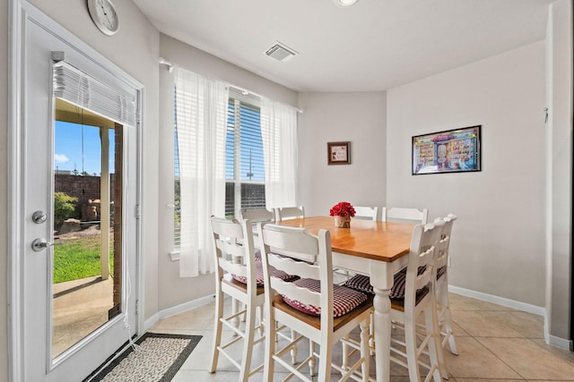 22610 Torrisdale Ln, Tomball, TX 77375 - dining room with light tile patterned floors and baseboards