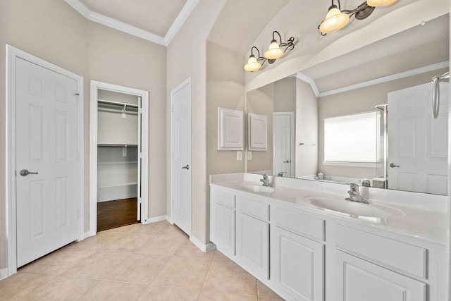 22610 Torrisdale Ln, Tomball, TX 77375 - full bathroom with ornamental molding, double vanity, tile patterned floors, a spacious closet, and vaulted ceiling