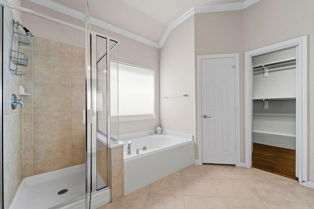 22610 Torrisdale Ln, Tomball, TX 77375 - full bath with a stall shower, a bath, ornamental molding, a spacious closet, and tile patterned floors