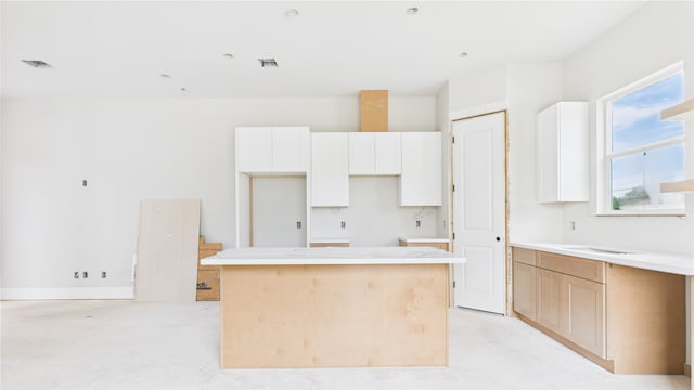 1102 Mansfield St Unit A, Houston, TX 77091 - kitchen featuring a center island and white cabinets