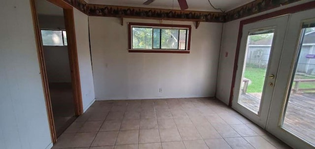 6136 25th St, Groves, TX 77619 - spare room with light tile patterned floors and ceiling fan