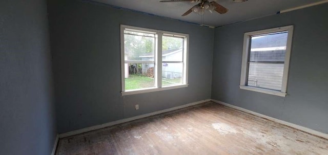 6136 25th St, Groves, TX 77619 - spare room with plenty of natural light, a ceiling fan, baseboards, and wood finished floors