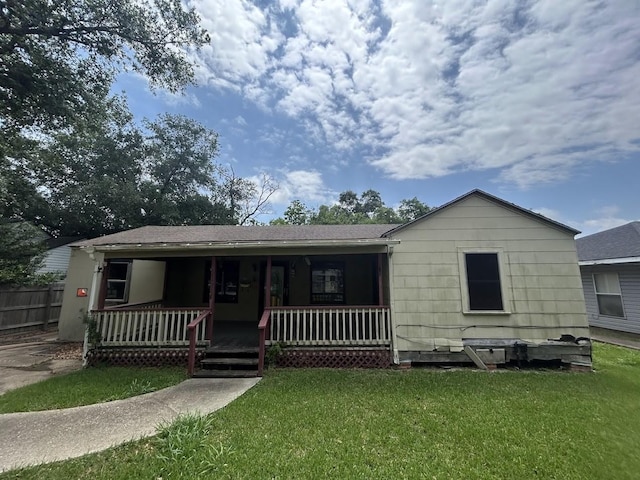 6136 25th St, Groves, TX 77619 - view of front facade featuring a porch