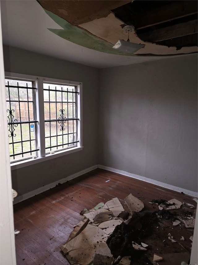 5318 Longmeadow St, Houston, TX 77033 - empty room featuring hardwood / wood-style flooring and baseboards