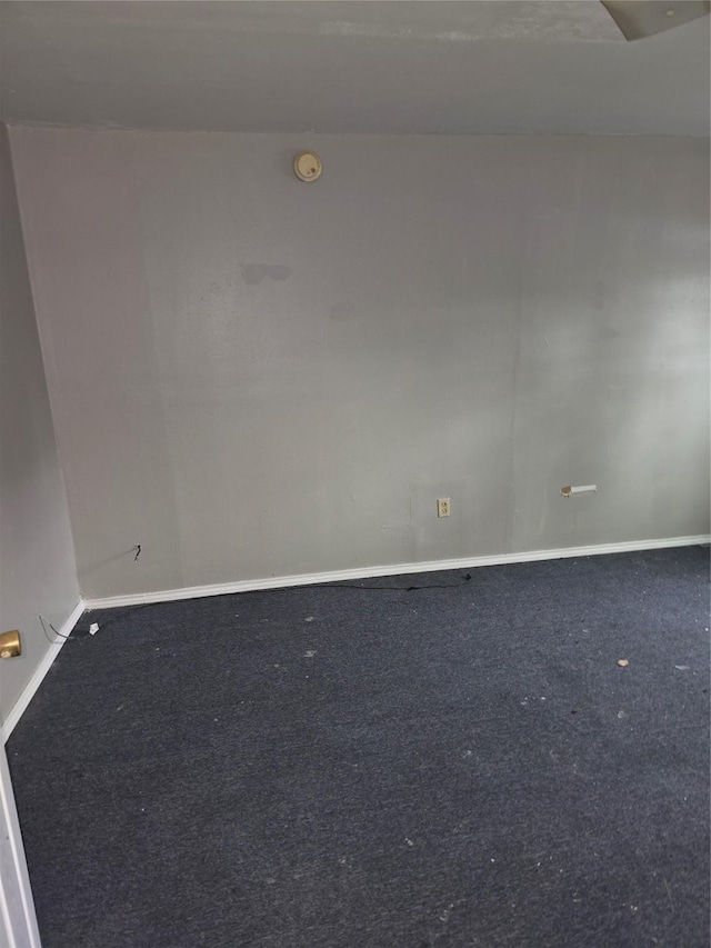 5318 Longmeadow St, Houston, TX 77033 - carpeted empty room with baseboards and a smoke detector