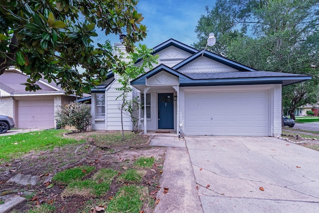 23426 Prairie Bird Dr, Spring, TX 77373 - ranch-style home with concrete driveway, a garage, and brick siding