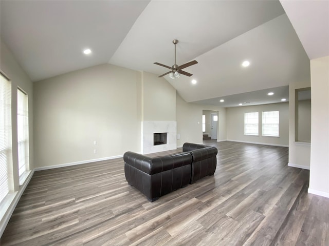 301 Old Bayou Dr, Dickinson, TX 77539 - living area featuring a ceiling fan, lofted ceiling, a fireplace, wood finished floors, and recessed lighting