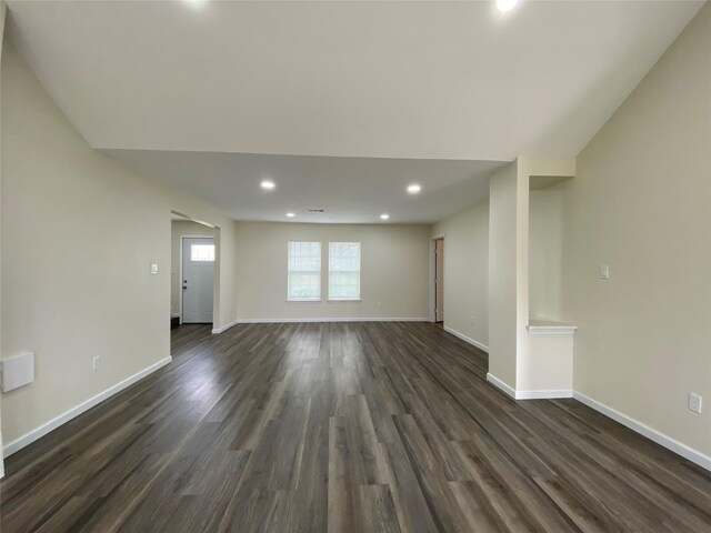 301 Old Bayou Dr, Dickinson, TX 77539 - unfurnished living room featuring dark wood finished floors and recessed lighting