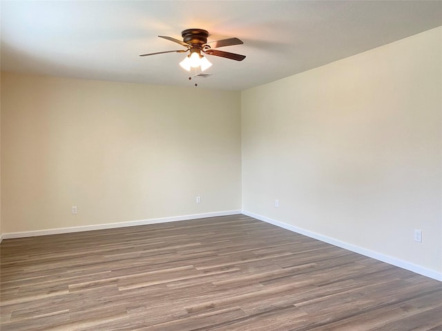 301 Old Bayou Dr, Dickinson, TX 77539 - empty room featuring ceiling fan and dark wood-style flooring
