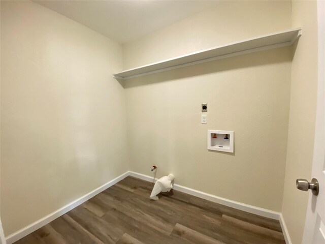 301 Old Bayou Dr, Dickinson, TX 77539 - laundry room with dark wood finished floors, hookup for a gas dryer, washer hookup, and hookup for an electric dryer