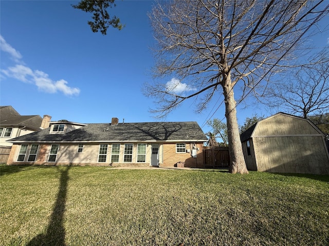 301 Old Bayou Dr, Dickinson, TX 77539 - rear view of house featuring a chimney, a shed, and brick siding
