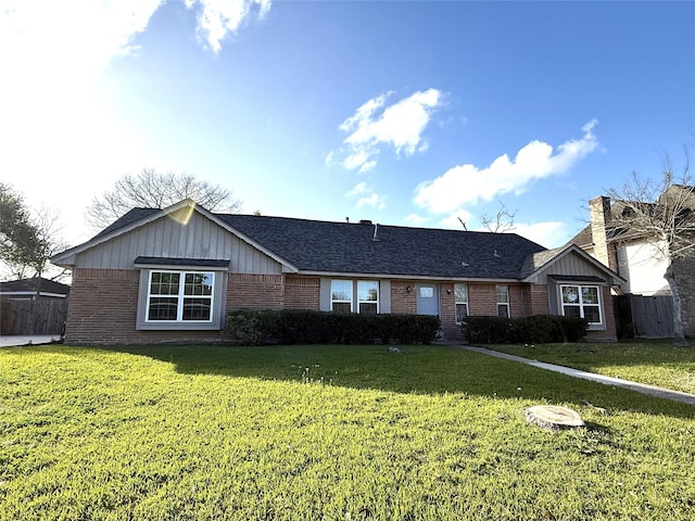 301 Old Bayou Dr, Dickinson, TX 77539 - ranch-style home with brick siding, roof with shingles, and board and batten siding