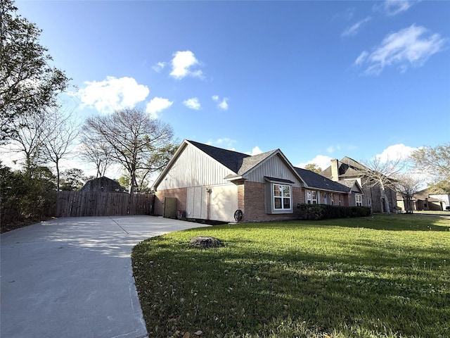 301 Old Bayou Dr, Dickinson, TX 77539 - view of property exterior with brick siding, driveway, a gate, and board and batten siding