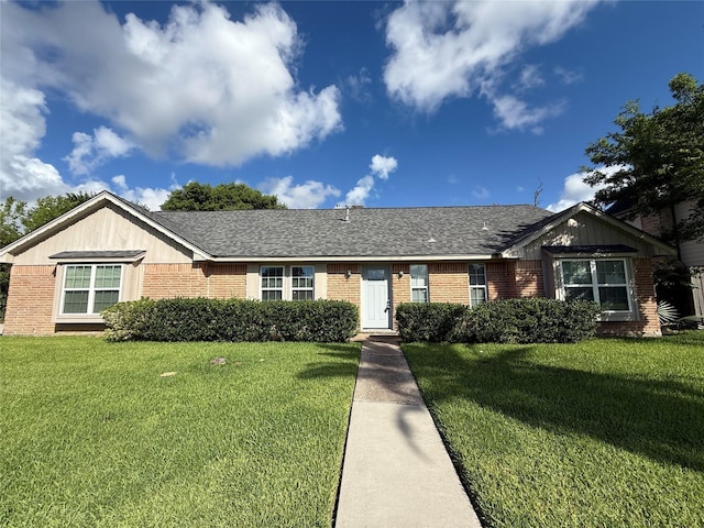 301 Old Bayou Dr, Dickinson, TX 77539 - ranch-style home featuring brick siding and a front yard