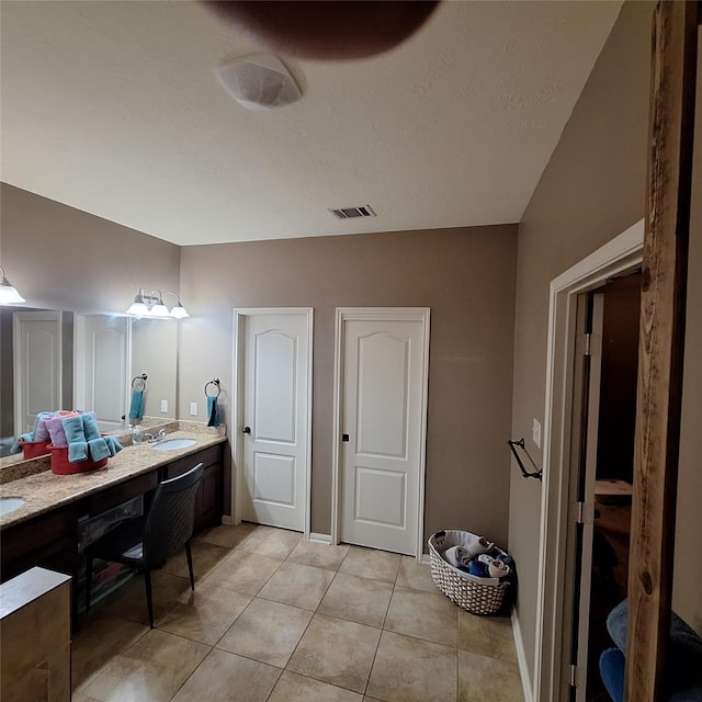 6110 Watford Bnd, Rosenberg, TX 77471 - bathroom featuring double vanity and tile patterned floors