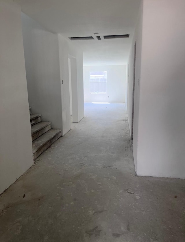 8114 Golden Trace Ct, Houston, TX 77083 - corridor featuring unfinished concrete floors and stairs