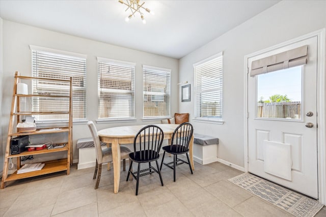 1861 Kenley Way, Alvin, TX 77511 - dining space with baseboards and light tile patterned floors