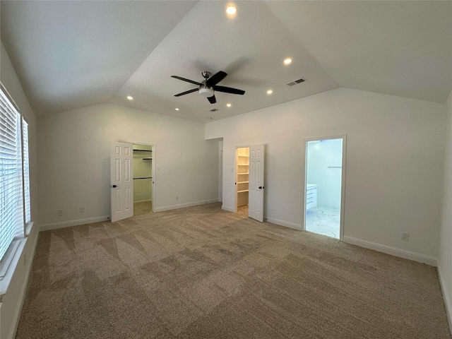 21207 Rushing Creek Ln, Katy, TX 77449 - unfurnished bedroom with lofted ceiling, a spacious closet, recessed lighting, light carpet, and connected bathroom