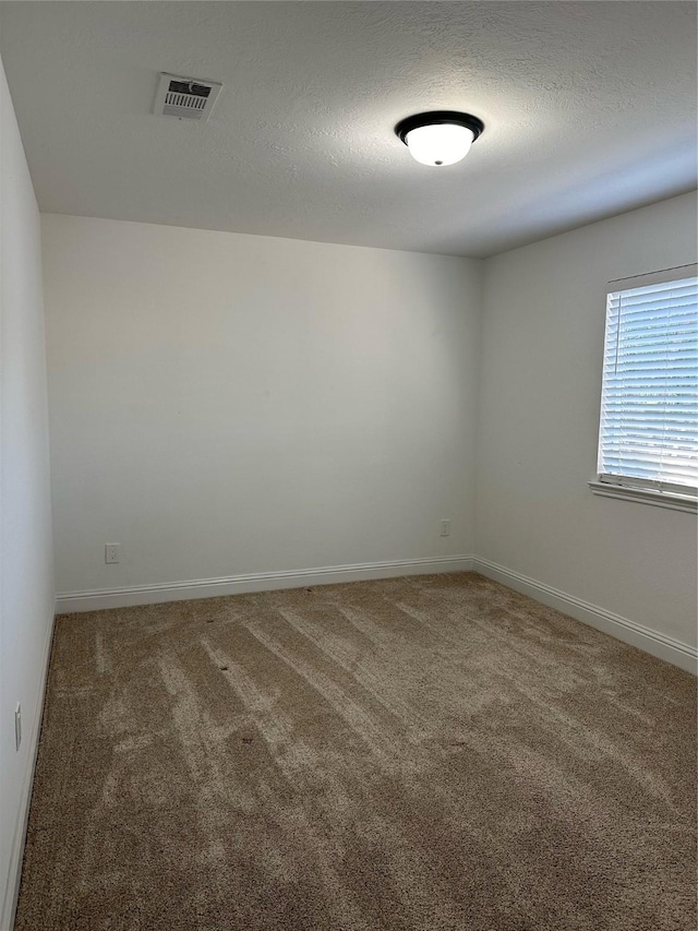 21207 Rushing Creek Ln, Katy, TX 77449 - carpeted spare room featuring baseboards and a textured ceiling