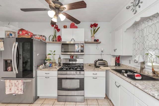 8209 Howard Dr, Houston, TX 77017 - kitchen featuring stainless steel appliances, open shelves, a sink, white cabinets, and light tile patterned flooring