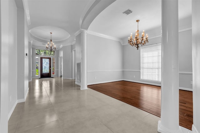 1930 Crisfield Dr, Sugar Land, TX 77479 - tiled foyer entrance with a chandelier, ornamental molding, ornate columns, baseboards, and arched walkways
