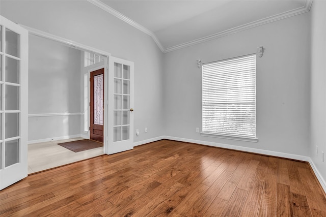 1930 Crisfield Dr, Sugar Land, TX 77479 - empty room with crown molding, french doors, hardwood / wood-style floors, and baseboards