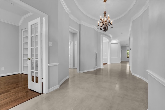 1930 Crisfield Dr, Sugar Land, TX 77479 - corridor featuring a chandelier, crown molding, tile patterned flooring, and baseboards