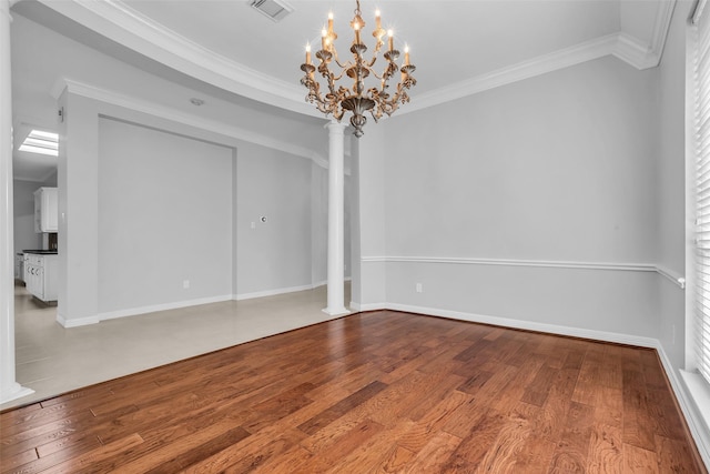 1930 Crisfield Dr, Sugar Land, TX 77479 - empty room with decorative columns, hardwood / wood-style flooring, ornamental molding, a chandelier, and baseboards