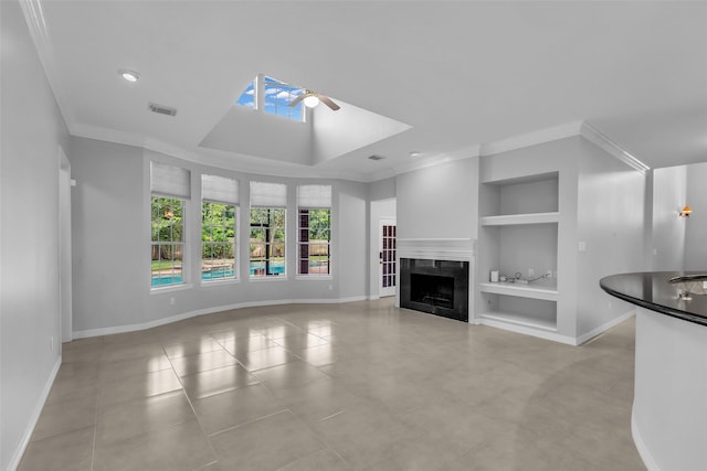 1930 Crisfield Dr, Sugar Land, TX 77479 - unfurnished living room featuring built in features, a ceiling fan, ornamental molding, baseboards, and tile patterned floors