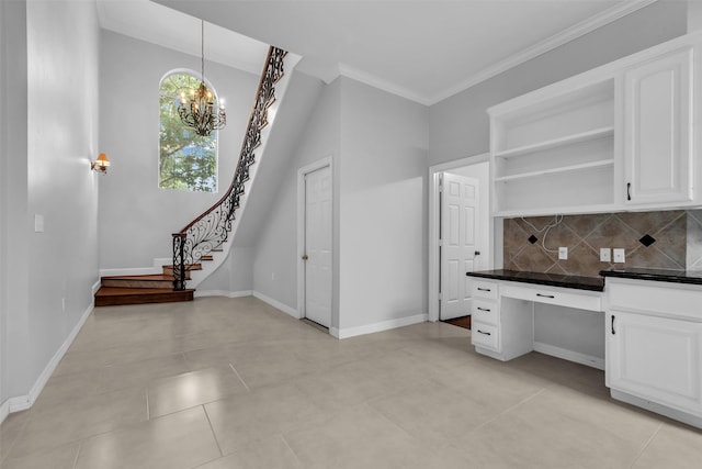 1930 Crisfield Dr, Sugar Land, TX 77479 - kitchen with dark countertops, open shelves, white cabinets, backsplash, and a chandelier