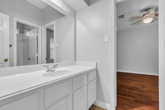 1930 Crisfield Dr, Sugar Land, TX 77479 - bathroom with vanity, ceiling fan, wood finished floors, baseboards, and a shower