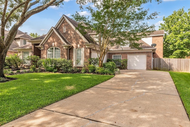 1930 Crisfield Dr, Sugar Land, TX 77479 - traditional-style house with brick siding, a garage, concrete driveway, and a shingled roof