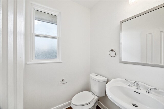 2402 Calumet St Unit C, Houston, TX 77004 - bathroom with a sink, toilet, and baseboards