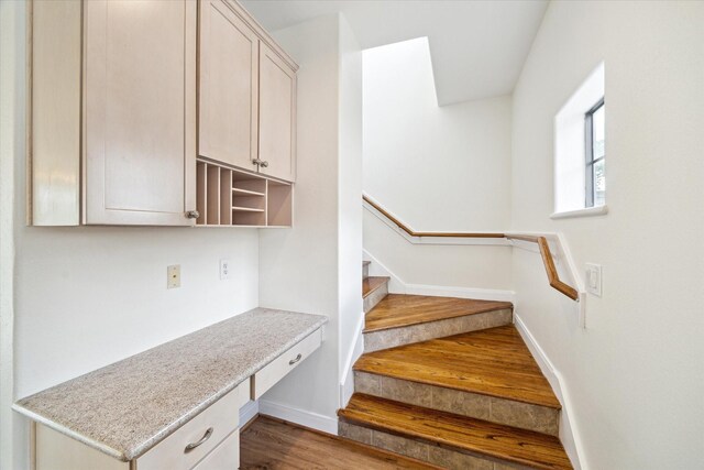 2402 Calumet St Unit C, Houston, TX 77004 - staircase with wood finished floors, baseboards, and built in desk