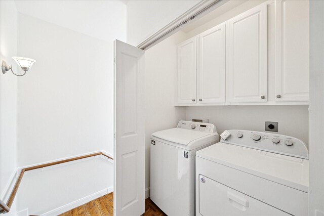 2402 Calumet St Unit C, Houston, TX 77004 - washroom with cabinet space, washer and dryer, and wood finished floors