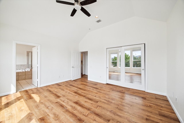 2402 Calumet St Unit C, Houston, TX 77004 - unfurnished bedroom featuring lofted ceiling, light wood-style floors, access to exterior, connected bathroom, and ceiling fan