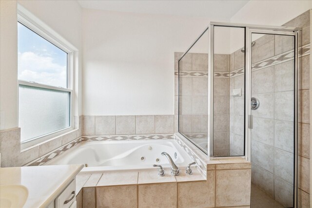 2402 Calumet St Unit C, Houston, TX 77004 - bathroom with a tub with jets, a stall shower, and vanity