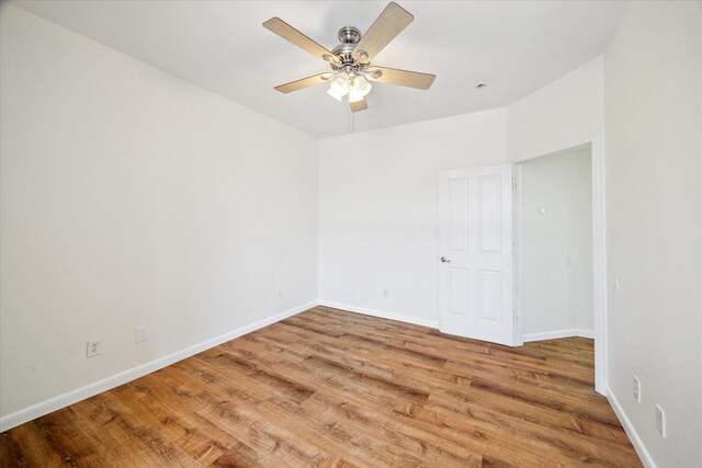 2402 Calumet St Unit C, Houston, TX 77004 - empty room with wood finished floors, ceiling fan, and baseboards