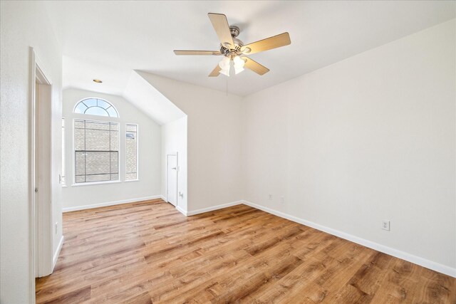 2402 Calumet St Unit C, Houston, TX 77004 - empty room featuring light wood-style floors, baseboards, a ceiling fan, and vaulted ceiling