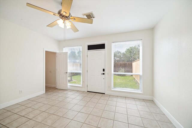 2402 Calumet St Unit C, Houston, TX 77004 - foyer featuring light tile patterned floors, baseboards, and ceiling fan