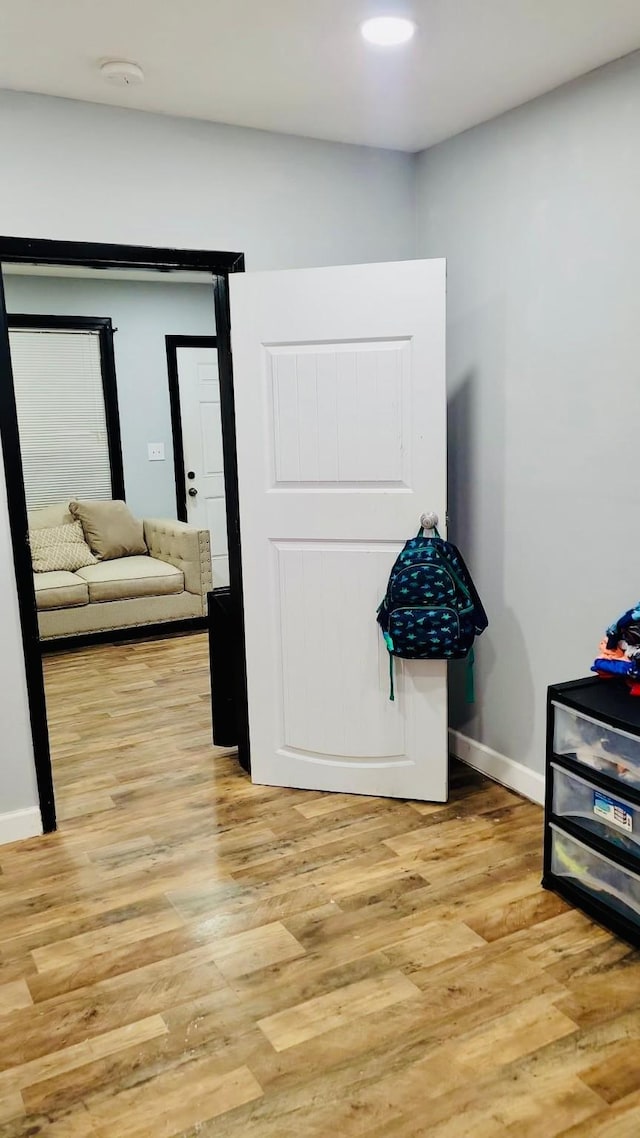6115 Jade Ave, Port Arthur, TX 77640 - hallway with light wood-type flooring and baseboards