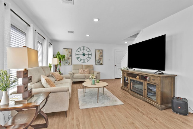 317 Riverwood Village Ln, Sealy, TX 77474 - living area with wood finished floors, recessed lighting, and baseboards